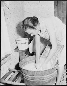 Mrs._Sergent_washing._She_is_a_tireless_and_meticulous_housekeeper_and_her_children_are_always_in_clean,_starched_and..._-_NARA_-_541373 (1)